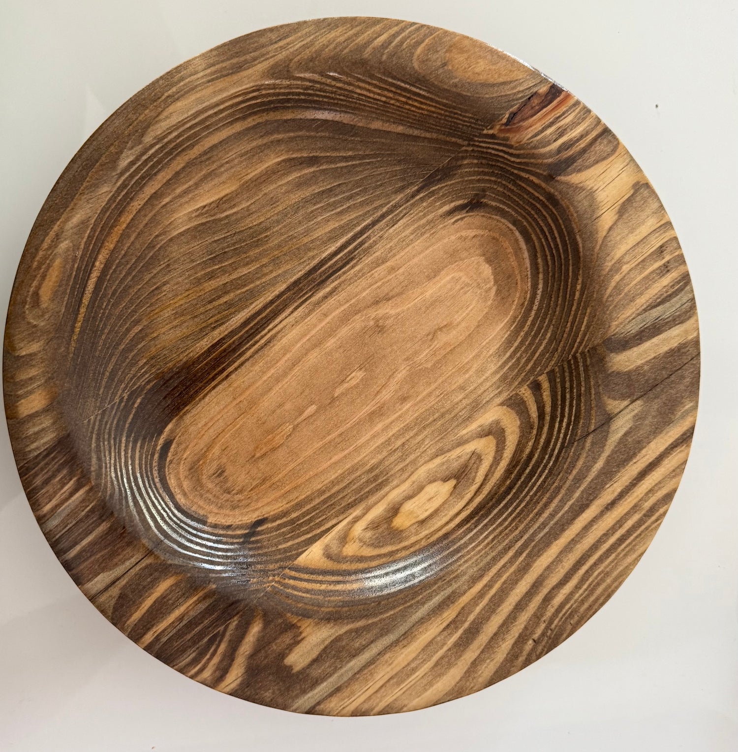 Handcrafted wooden bowl showcasing natural wood grain for woodworking home decor collection